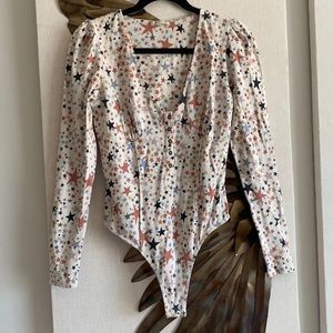 Super sexy/fun free people bodysuit has lots of sculpting features! Worn once